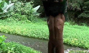 Brown soldier strips naked by the stream